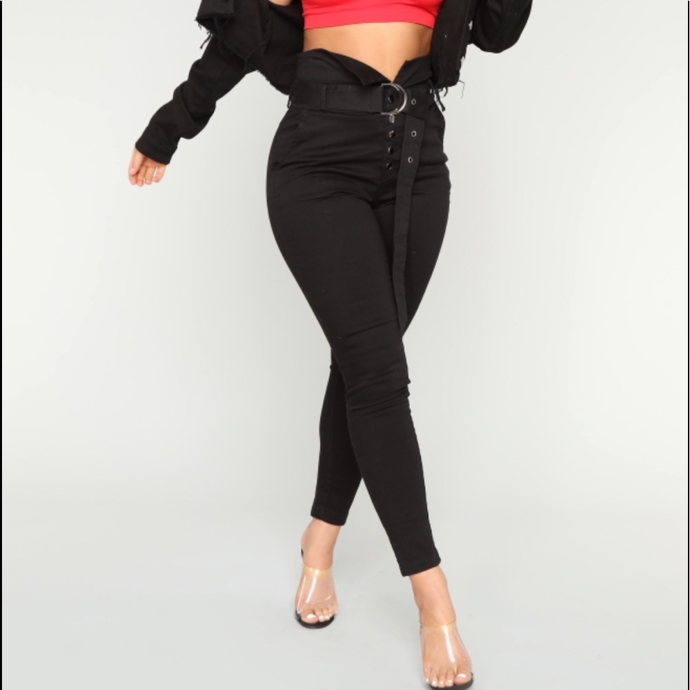 Black button up front pants with belt accent.